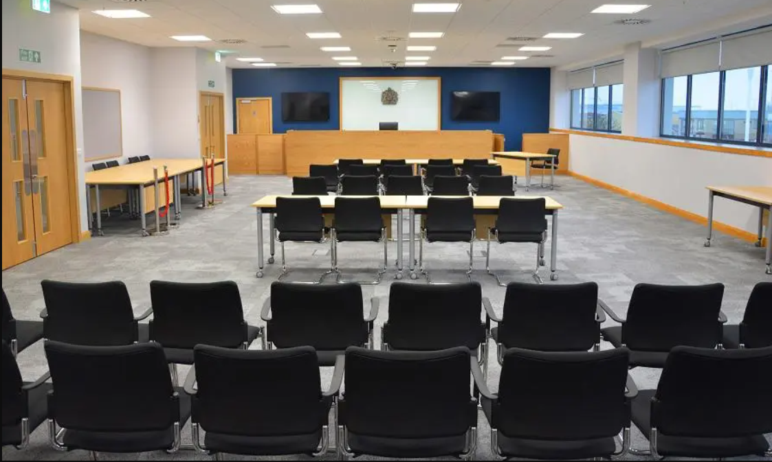 Coroners main court set out with chairs and tables. 