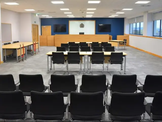 Coroners main court set out with chairs and tables.